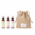 There are three dropper bottles  with essences from left to right: Bach™ Original Flower Remedies Cerato, Bach™ Original Flower Remedies  Crab Apple and Bach™ Original Flower Remedies Larch. Next to the last essence there is a burlap bag with the Bach™ logo on it.