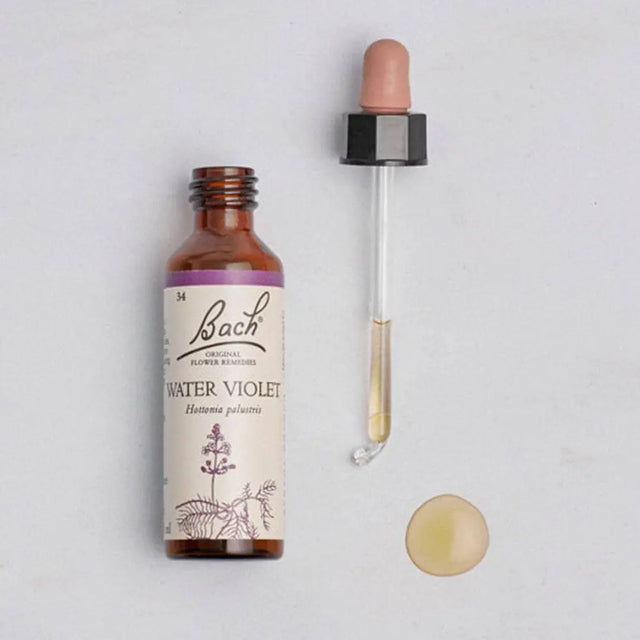 Bach™ Original Flower Remedy Water Violet 20ml opened and lay down on the left it is the bottle and on the right it is the dropper with some essence inside and at the bottom of the dropper, there is  a circle drop of the essence 