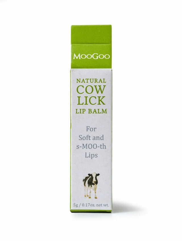 White Carton box packaging  front label reads "MooGoo  (in a green background) Natural Cow Lick Lip Balm for soft and s-MOO-th lips, follow by an illustration of a cow, 5g/ 0.17 oz. net wt".