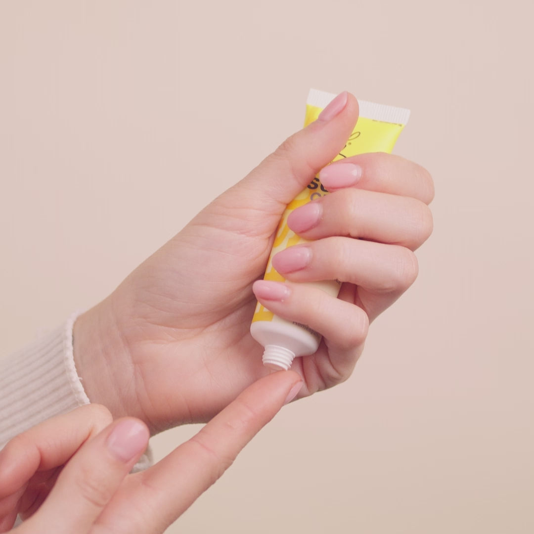 Video of one hand squeezing RESCUE® Cream and putting it on a finger of the other hand. 